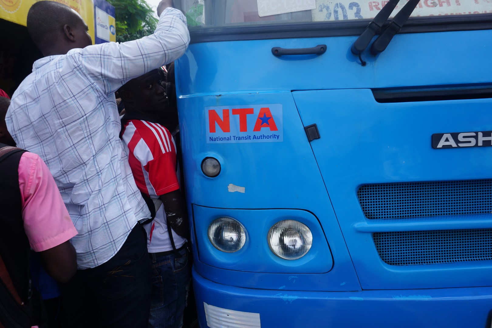 Passengers scramble to board a National Transit Authority Bus. Commuters frequently spend 30 minutes to 1 hour to find a ride during rush hour. Photo: Jefferson Krua
