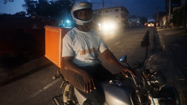 A delivery driver for Cookshop sits on his bike. Photo: Jefferson Krua