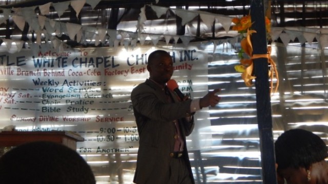 Pastor Askie speaks to the congregation