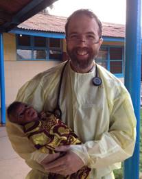 Dr. Sacra at ELWA with a baby he delivered. Photo: Rick Sacra