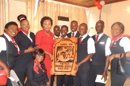Brussels Airlines staff pose with seal presented by the Liberia Airport Authority. Photo: Gbatemah Senah 