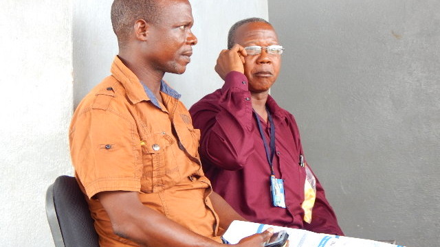 DEO Martor (right) and Acting Nimba County Education Officer Moses Dologbay (left) at the Teachers Mobile Money launching Program in Ganta. Photo: Arrington Ballah 