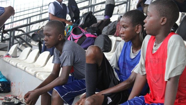 Students rest after a training session at Antoinette Tubman Stadium. Photo: Lloyd Massah