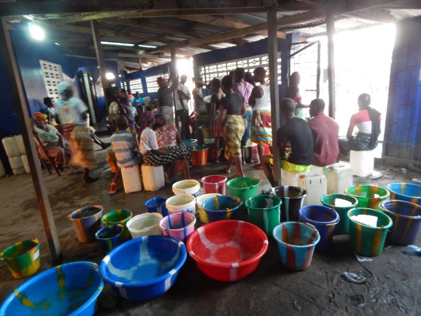 Residents in Central Monrovia wait early morning for water. Photo: Zeze Ballah 