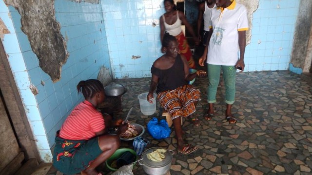 Squatter Nancy Karyea and her mother Prepare food at Rehab Center. Photo: Zeze Ballah 