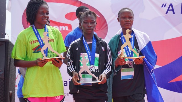 Jemu Zarzar (left) came in third place in the 10k race, behind Aminata Kargbo  and winner Fatmata Lumeh, both from Sierra Leone. Photo: Jefferson Krua