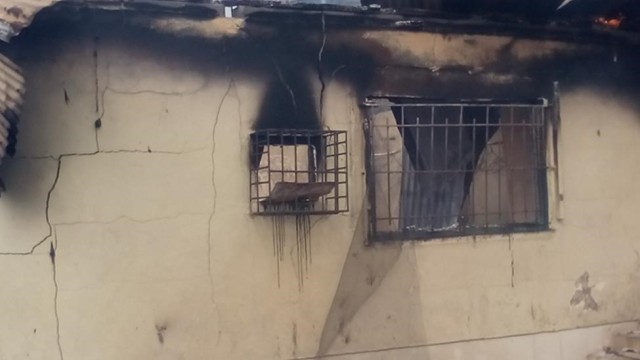 House allegedly set ablaze by angry residents. Photo: Festus Taylor