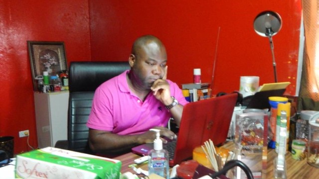 Rodney Sieh at his Front Page Africa office. Photo: Zeze Ballah